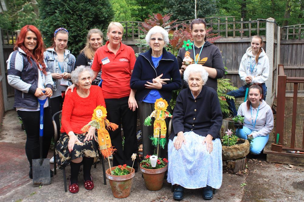 Students show the residents of Churchfield Care home the fruits of their labour