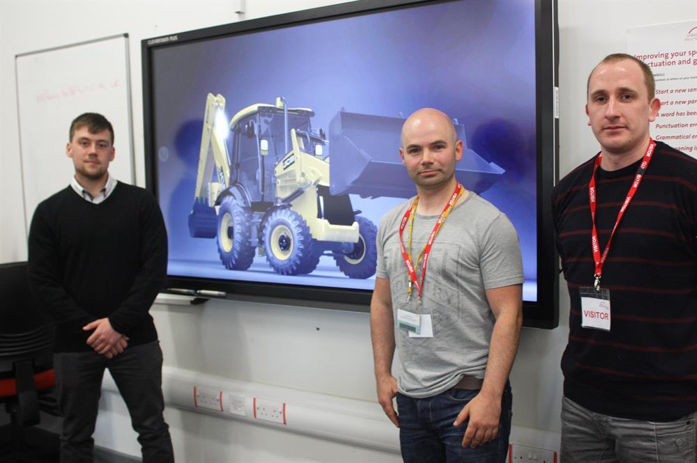 Patrick Ryder (left) shows Andrew Otter and Paul Chamberlain his animated advert
