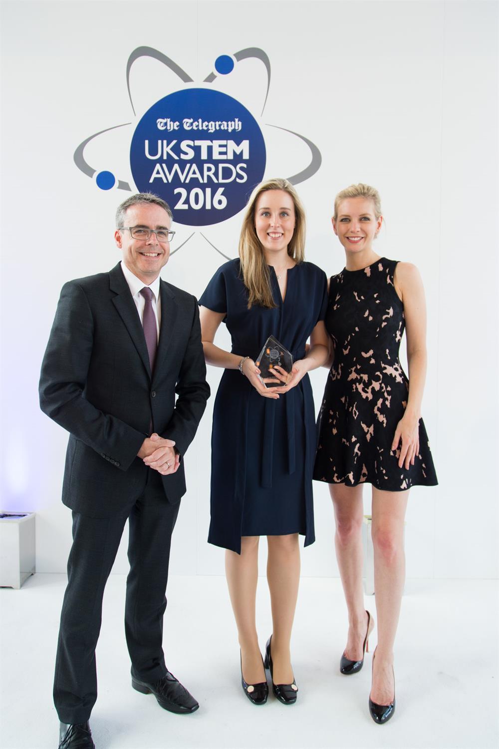 Abi Wetton receives her innovation award from McLaren's Patrick Bermingham and Rachel Riley