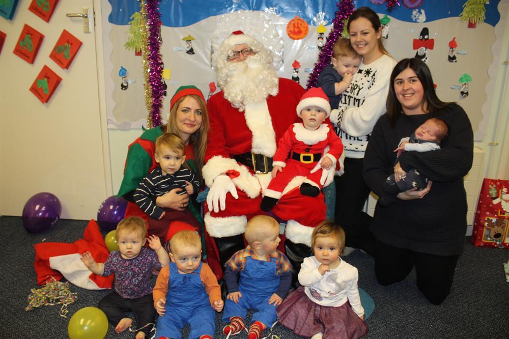 Santa and Elfie with the little ones at The Butterflies Day Nursery