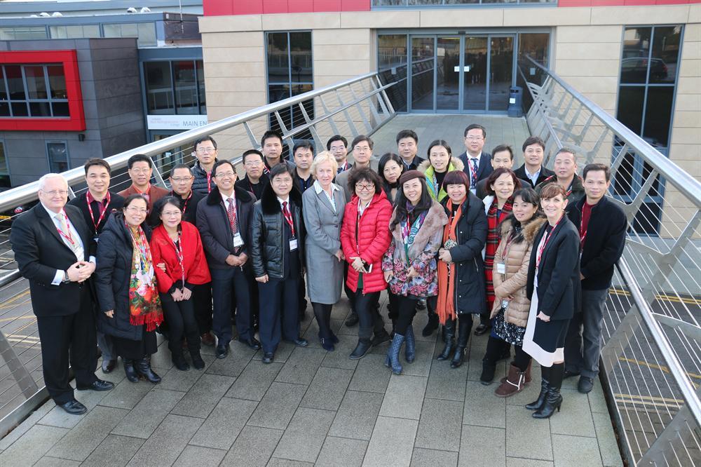 Deputy principal Patricia Harman (centre) welcomes the headteacher delegation from Guangdong