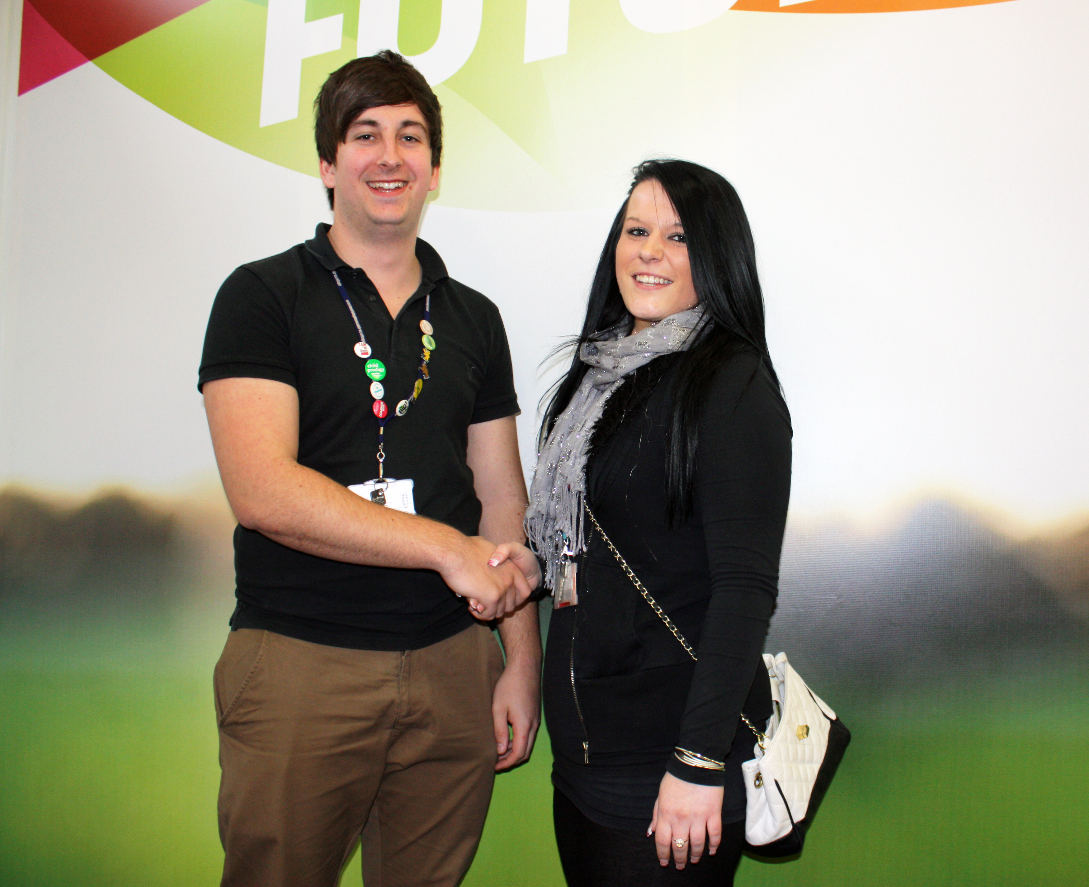Current president of the SU James Stafford congratulates Marie Oakton on her role as president for next academic year