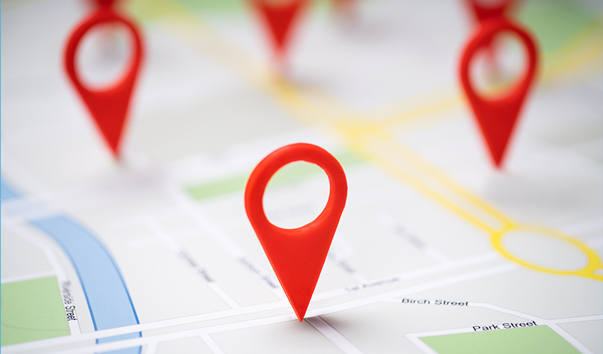 Image of a map with various pins on marking locations.
