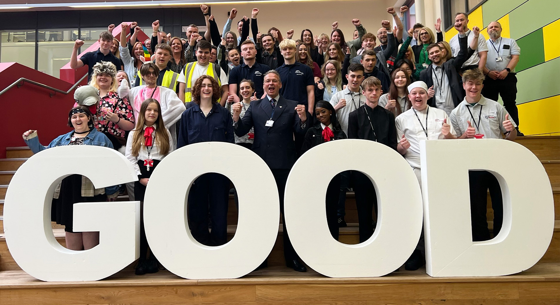 Students and staff join principal Andrew Cropley (front, centre) in celebrating the college’s Ofsted result.
