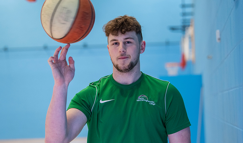 An image of a student spinning a basketball on his finger.