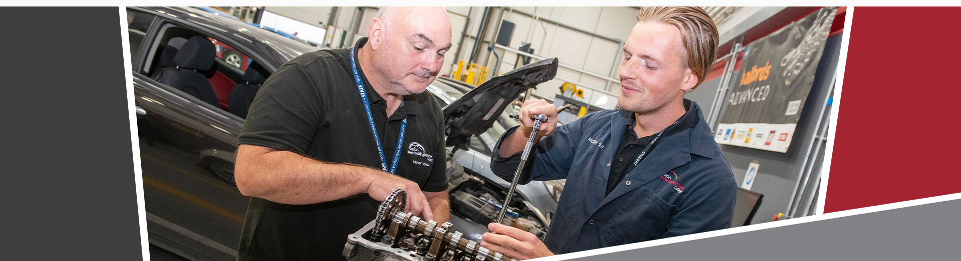 Motor vehicle apprentice with his tutor working on an engine