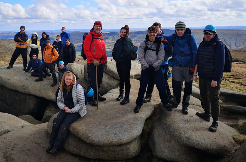 Uniformed protective services Mountaineering Club learners on the summit of Kinder Scout, the highest mountain in the Peak District.