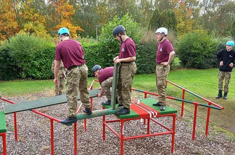 Uniformed protective services (UPS) students at West Nottinghamshire College proudly presented a military trials trophy to Principal Andrew Cropley after their grueling mock battlefield challenge.