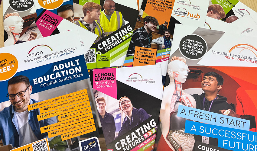 An image of multiple course guides spread out on a table.