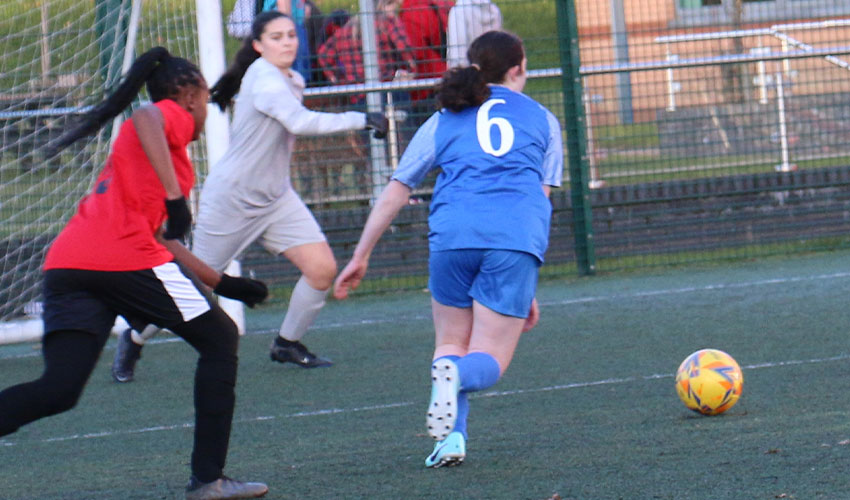 Girls playing football