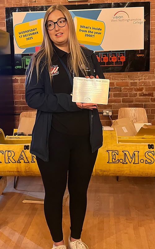 Engineering technician Kacey Gilberthorpe with a new plaque to commemorate this weeks event