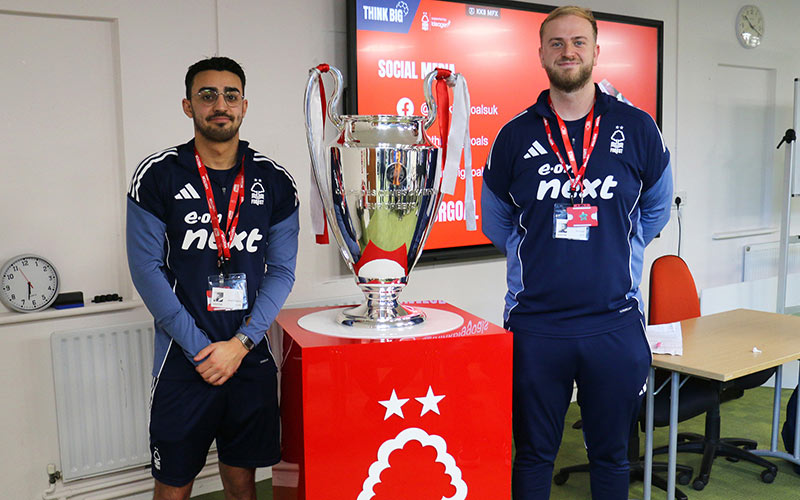 Dan Fisher and Jared Measures from Think Big with a replica of the European Cup.