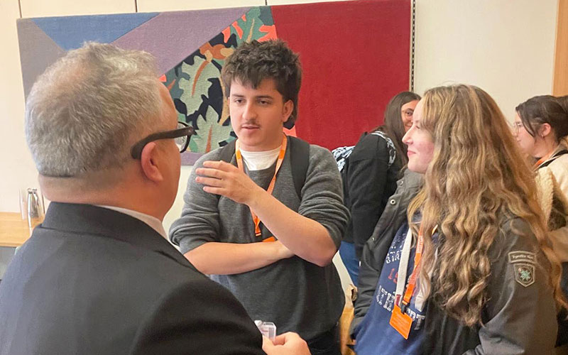 Students Callum Laidlaw and Philippa Adamson discussing careers in politics after the select committee with Lord Watson
