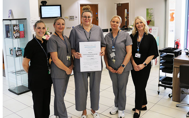 Proud college staff with Ragdale Hall Spa employee & Level 4 student Danielle Tetley (centre) proudly showing the Gold Award