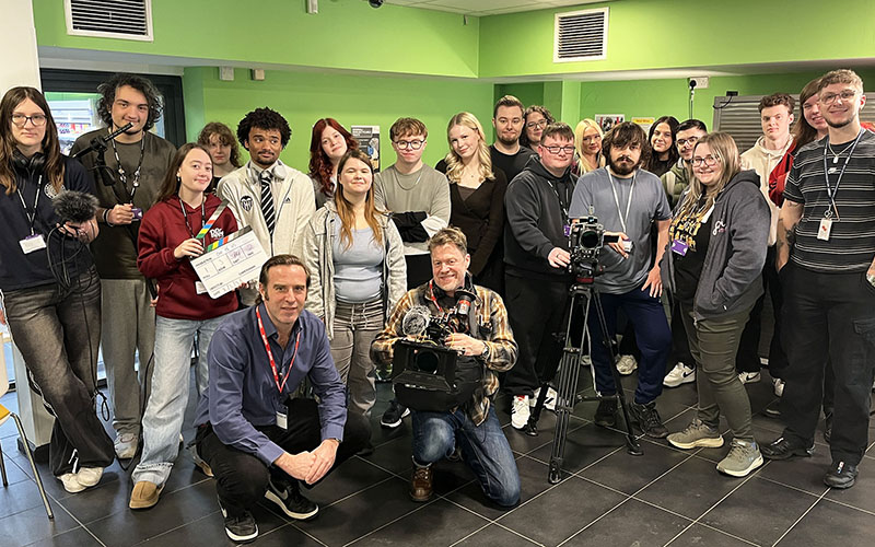 Godolphin Communications' Giles Bancroft and Rob Gould (front) with students who were involved with the film