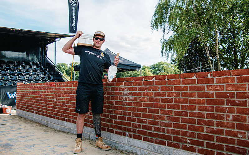 A jubilant Dale next to his award-winning wall