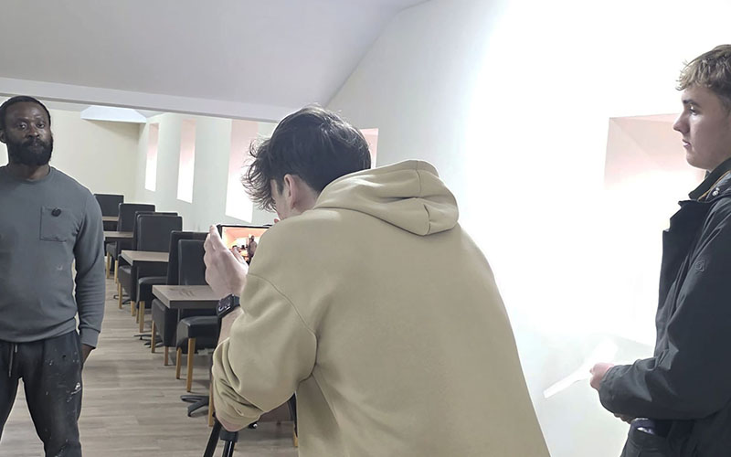 The duo filming business owner Maxwell Effah