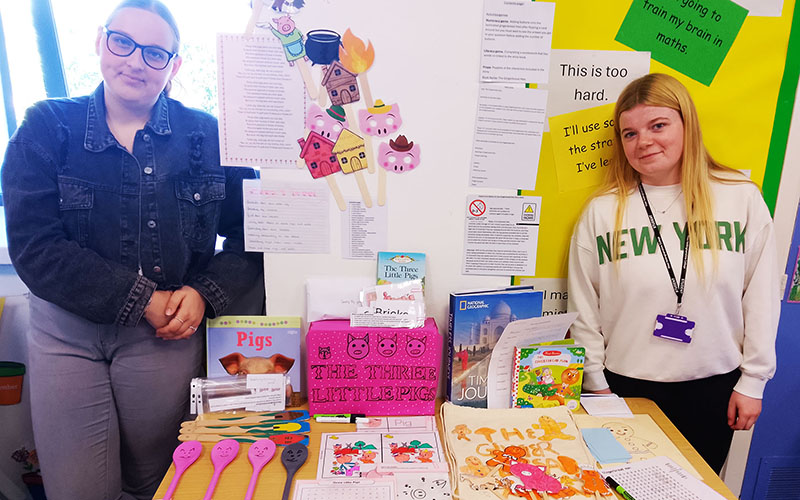 Millie Grace Allcock and Lily Yates with their chosen books and interactive resources