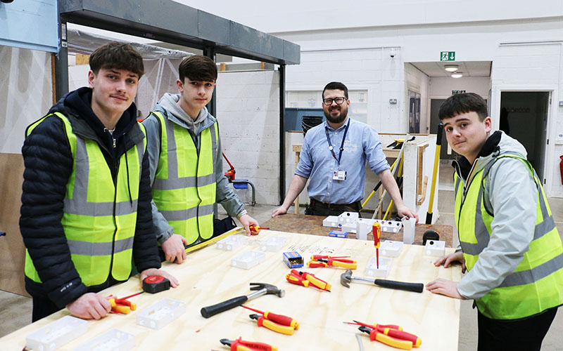 Quarrydale's Jacob Czarnecki, Alfie Coupe & Liam Naylor and teacher Robert Hardwick on electrical sockets