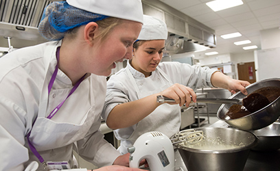 Image of two young women in a science lab