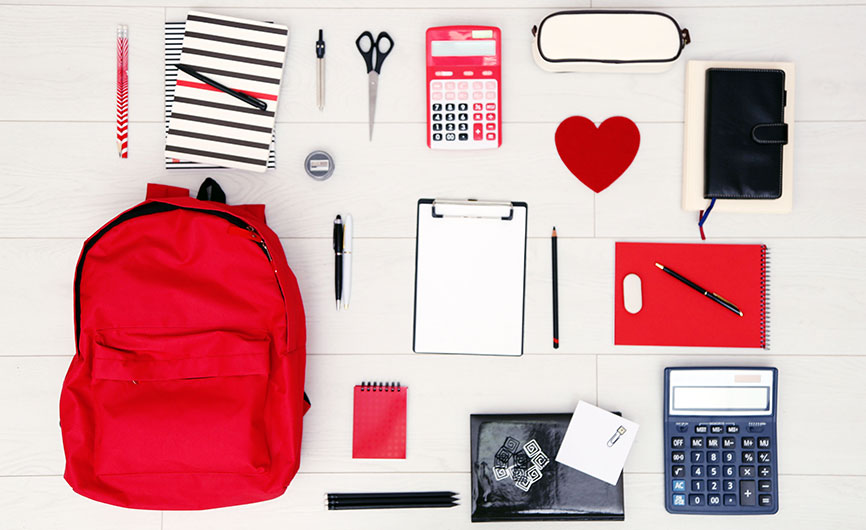 Image of multiple school/college equipment neatly laid out on a desk