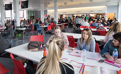 photo of students eating in a college diner