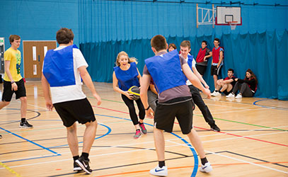 photo of students playing basketball