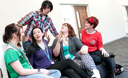 photo of students sitting on a chair, chatting