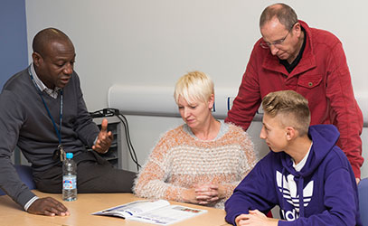 photo of teacher talking to parents