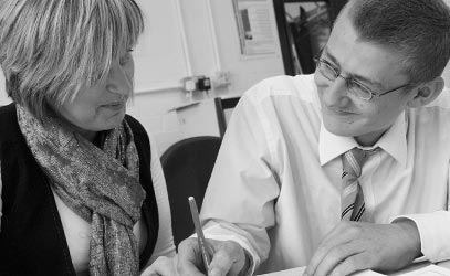 photo of two people learning