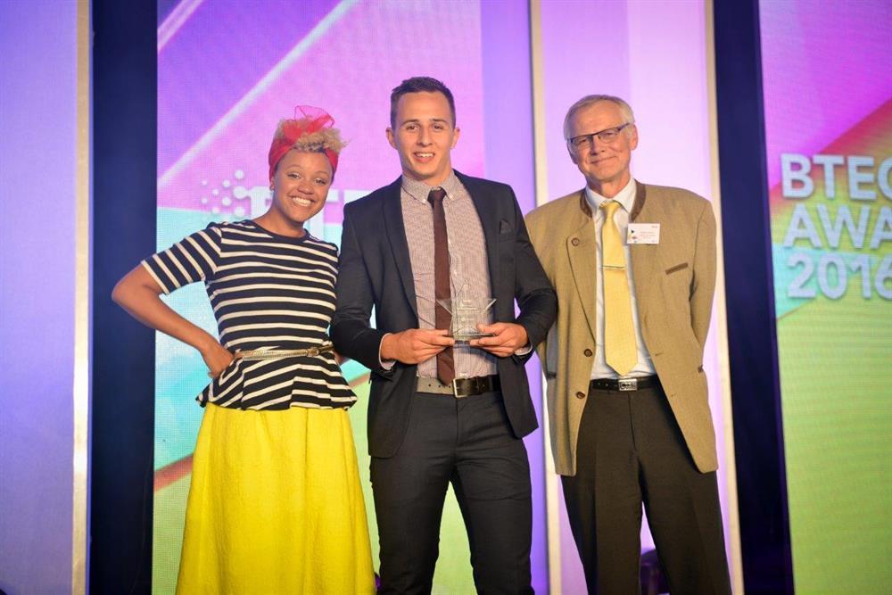 Sam with host Gemma Cairney from Radio 1 and Ralph Saelzer, managing director of Liebherr
