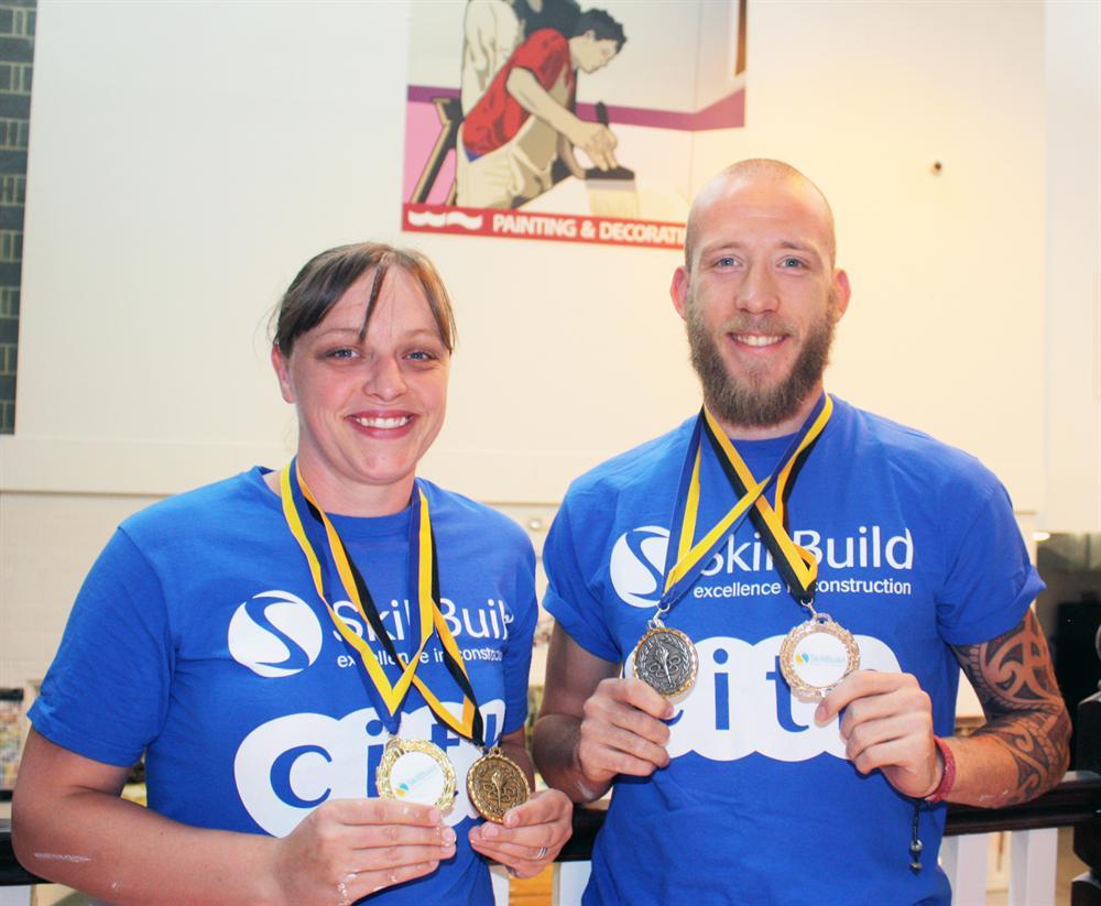 Anna Lodge and Frankie Hawson show off their gold and silver medals from the regional SkillBuild competitions.