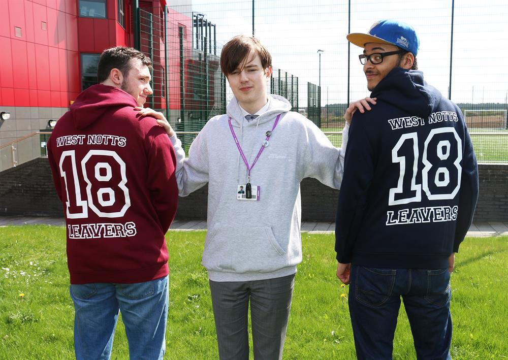 Cameron Moore (centre) with music students Jordan Pashley (left) and Milo Tooley-Okonkwo (right) modelling the new hoodies