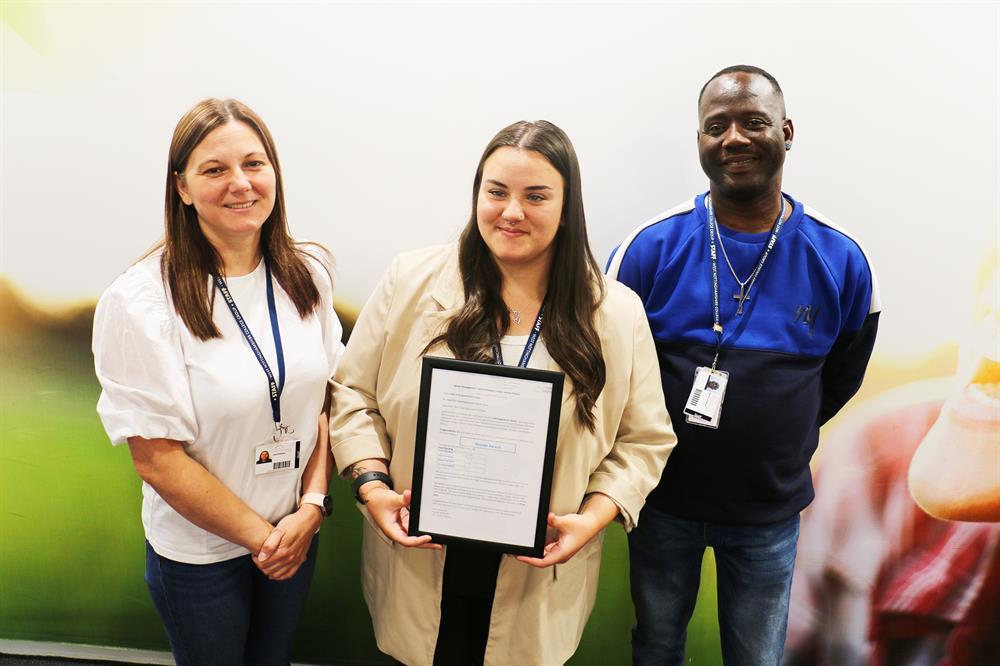 (Left to right) members of the care experienced team Lisa Coleman, Chloe Martin and Wayne Golding with the bronze charter