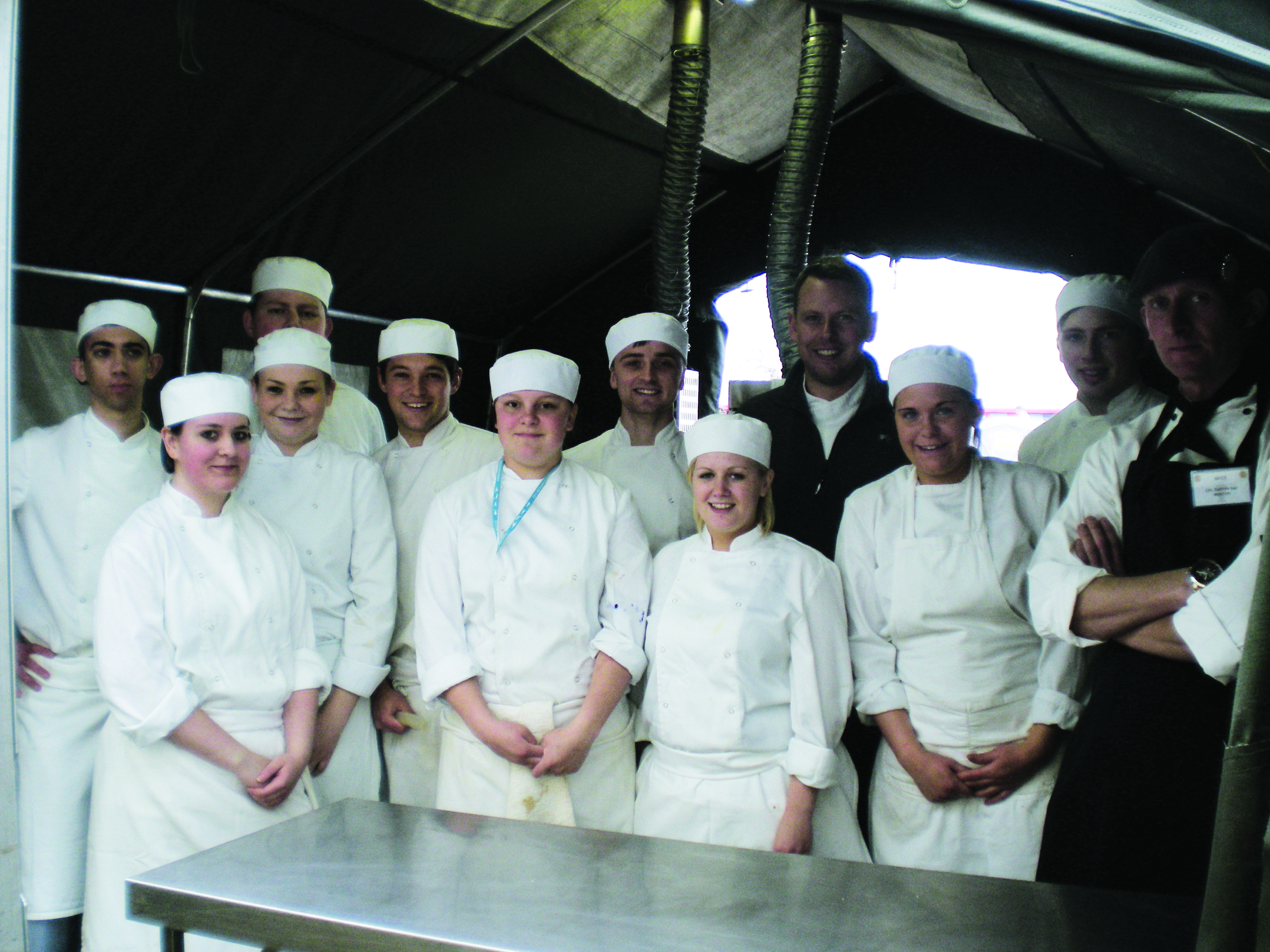 Student chefs in the field kitchen