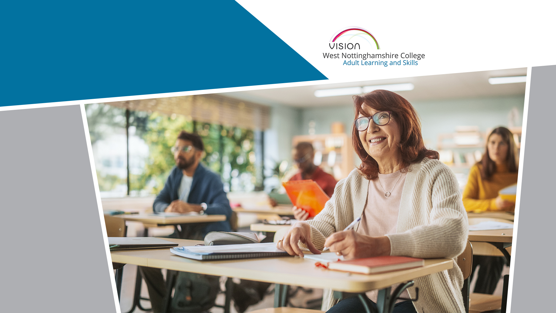 A female adult learner sat at a desk in a classroom.