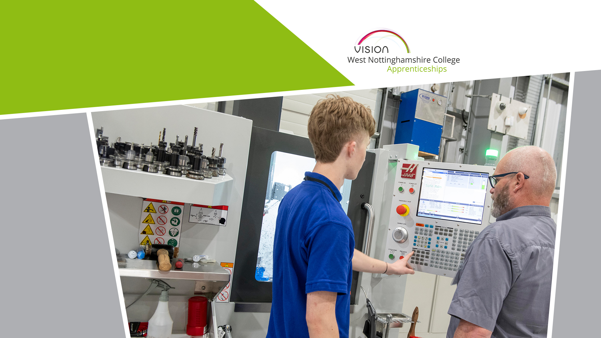 Two men looking at a digital control panel on an engineering machine.