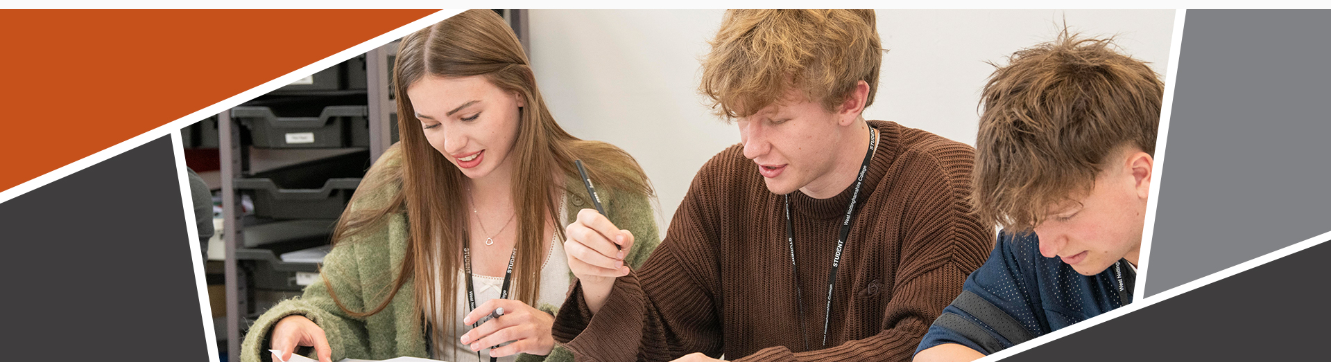 an image of a student writing on paper with equipment out on the table, including a calculator and a pencil case.