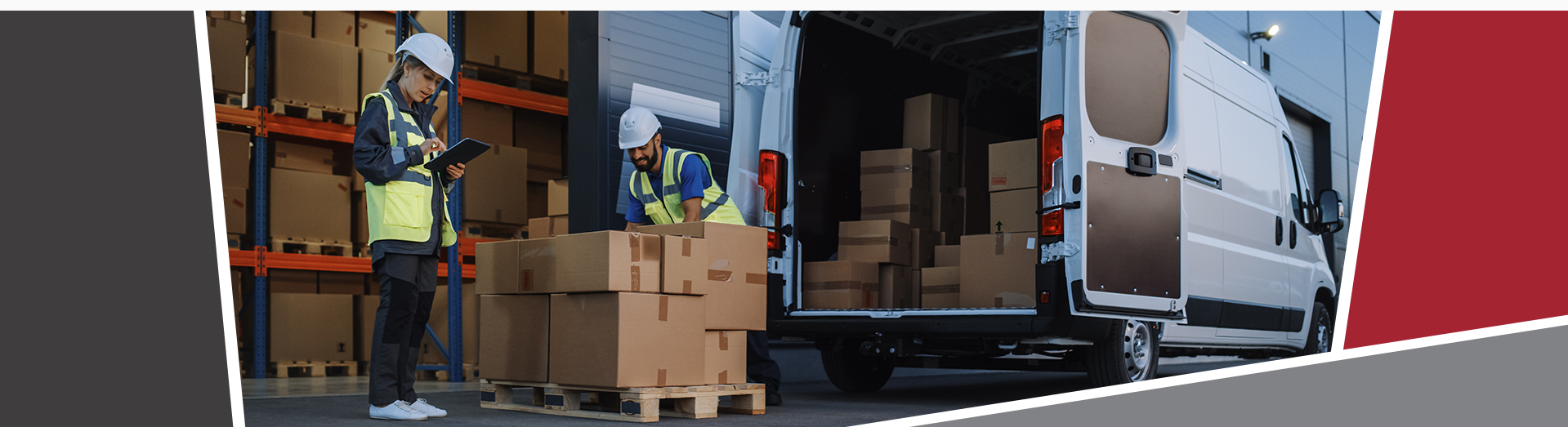 Two workers in high visibility vests, loading a van with large brown boxes.