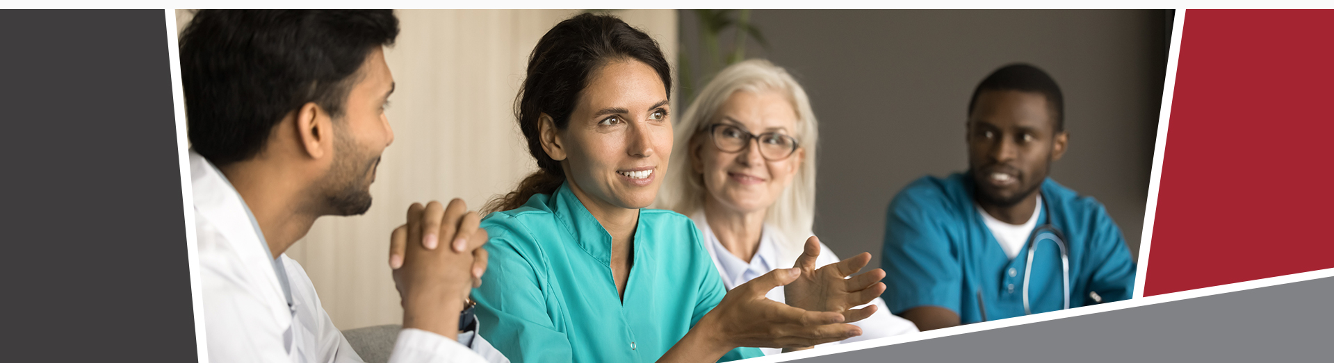 A group of four doctors sat at a table, discussing with each other. 