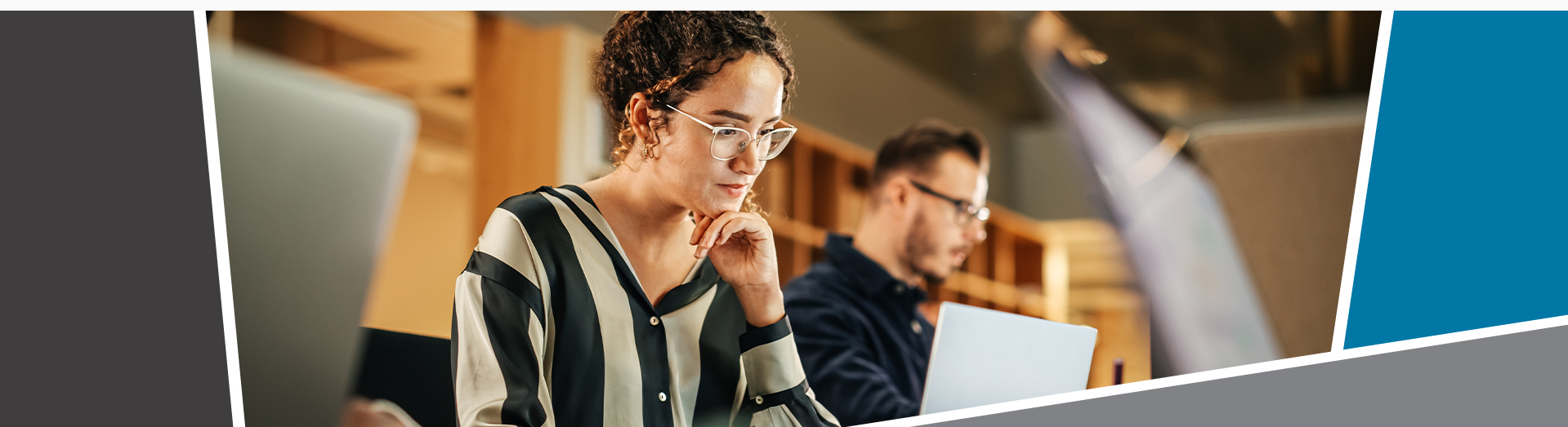 An adult learner smiling looking at the camera.