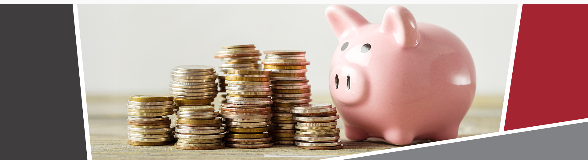 A piggy bank with stacks of coins next to it.