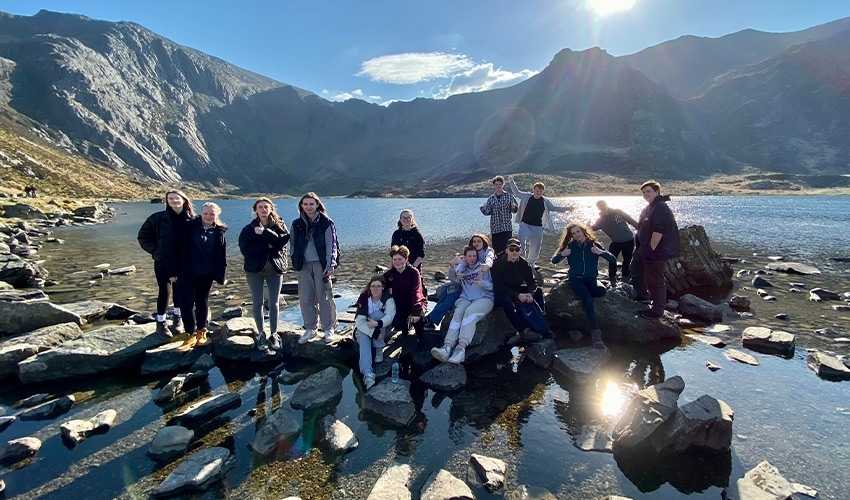 Exciting trip opportunities - here Environmental Science students are in North Wales, hiking up to a lake in Snowdonia.