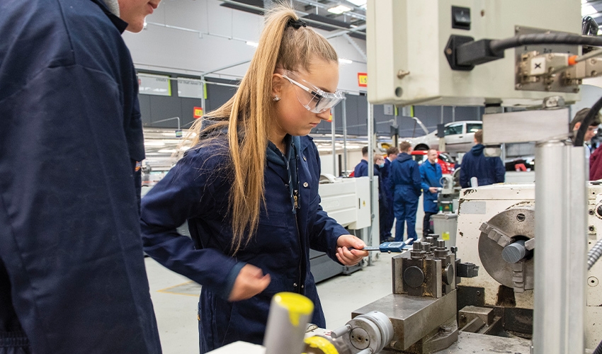 Practicing using industry-standard machinery helps students develop specialist skills.